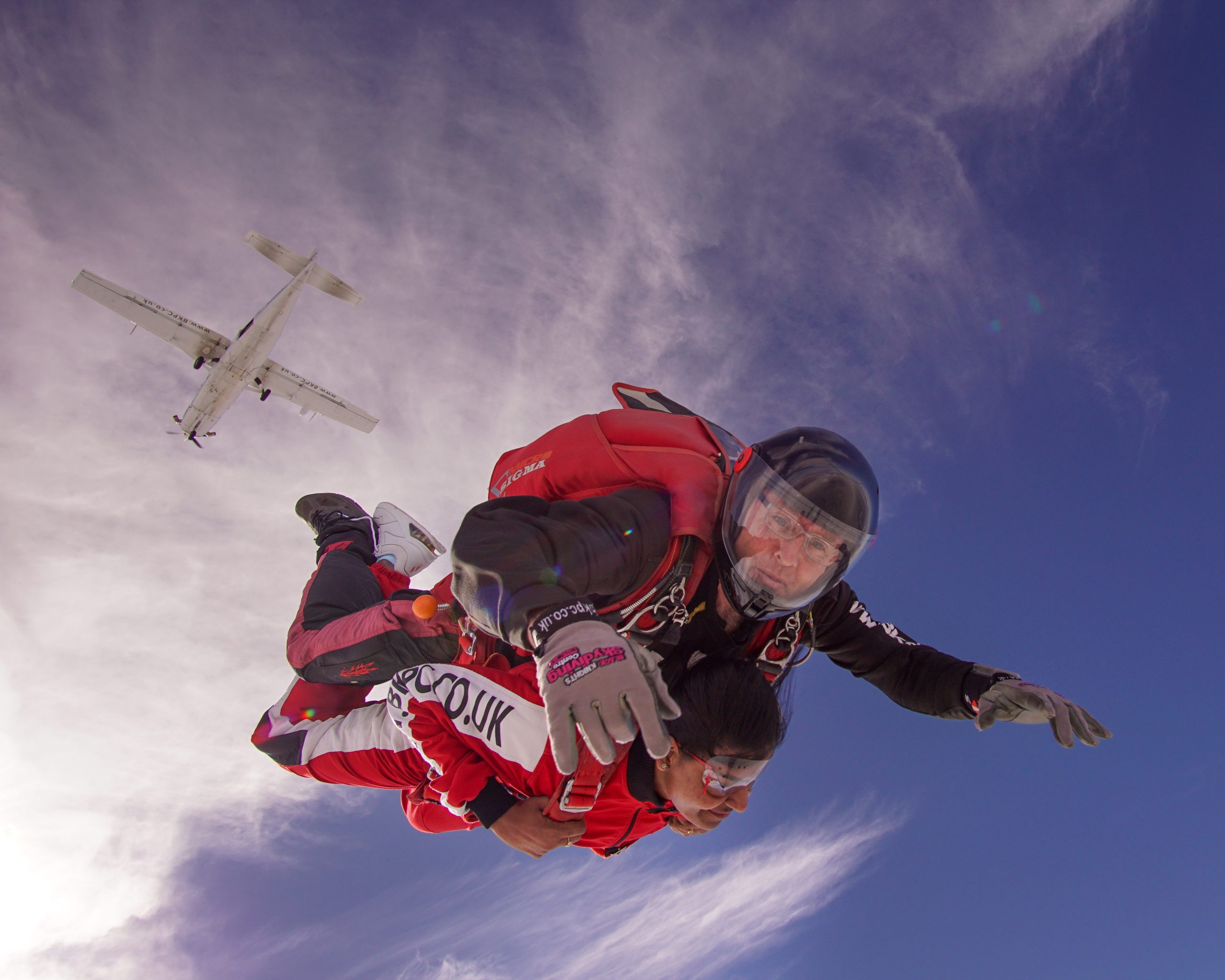 Tandem skydiving from an aircraft with instructor and jumper in freefall