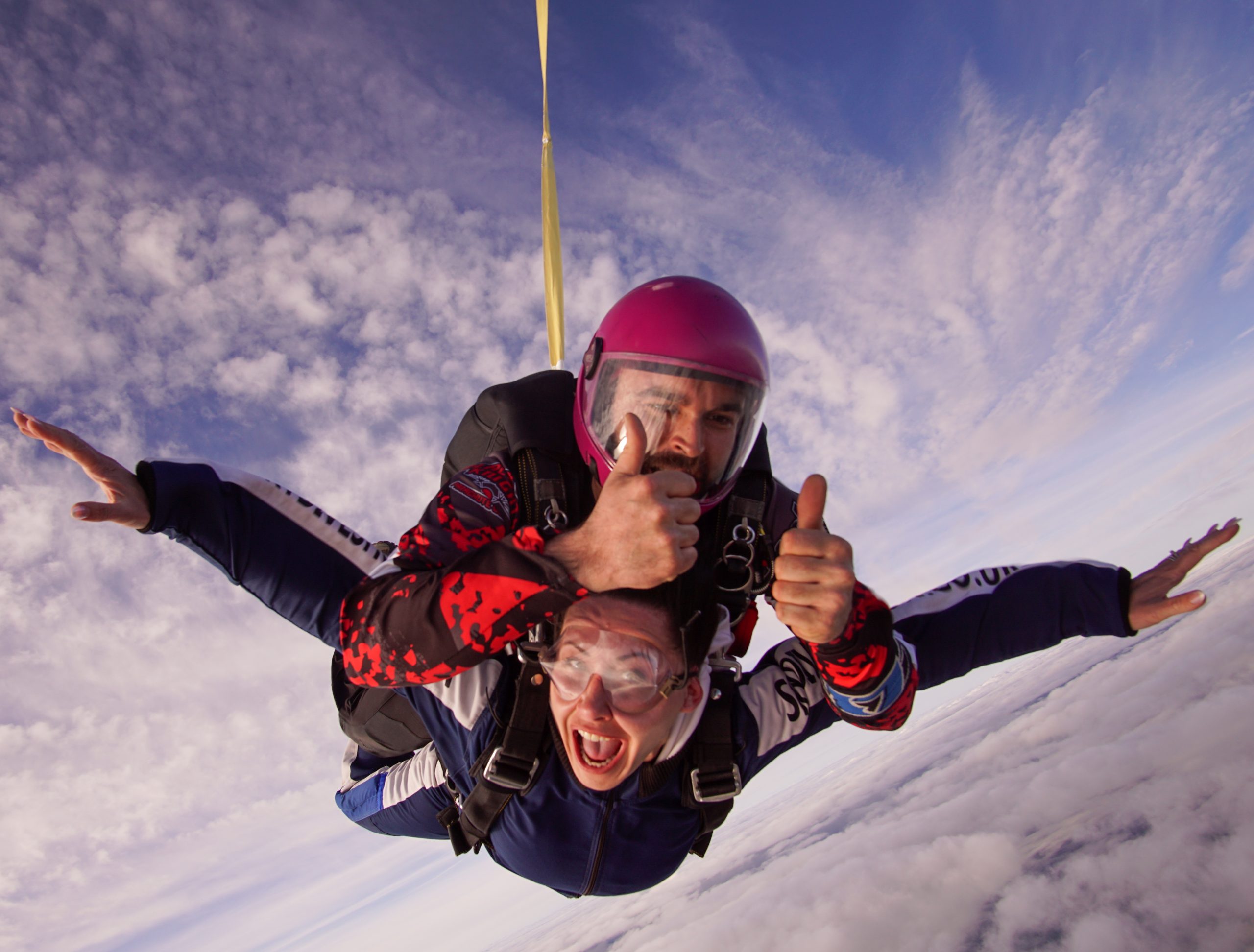 Tandem skydive near Sheffield with instructor giving thumbs up during freefall